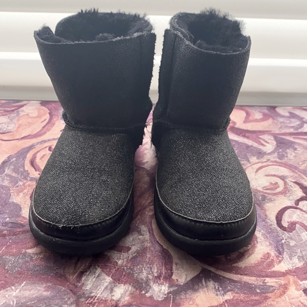 UGG sparkly black boots with shearling lining.